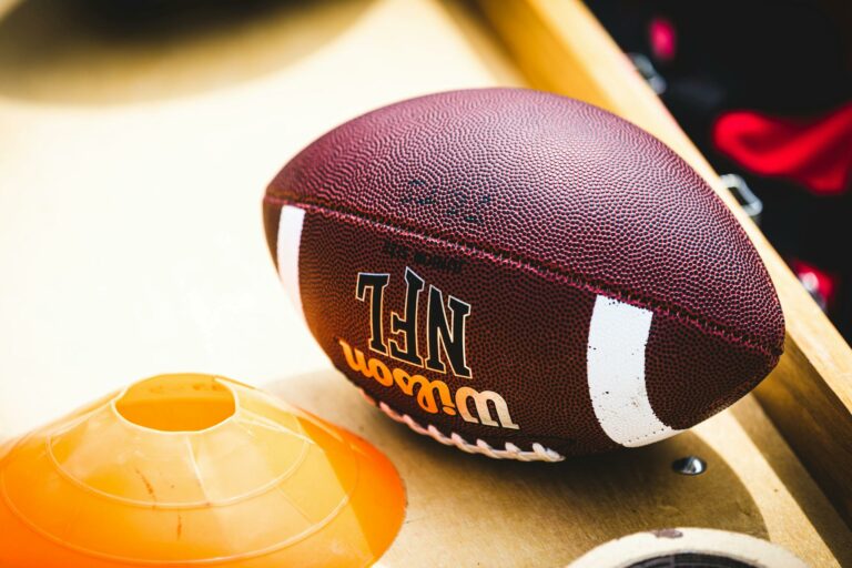 Brown and White Football on White Table